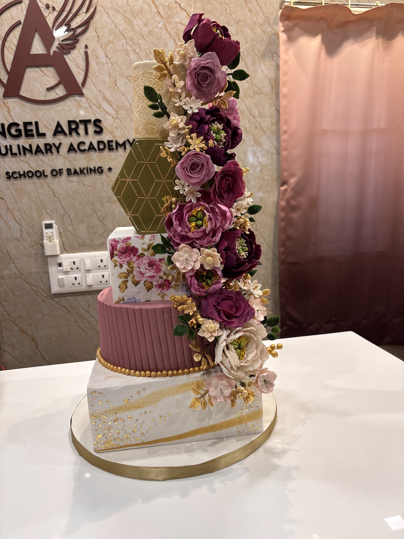 Pink floral wedding cake by Angel Arts
